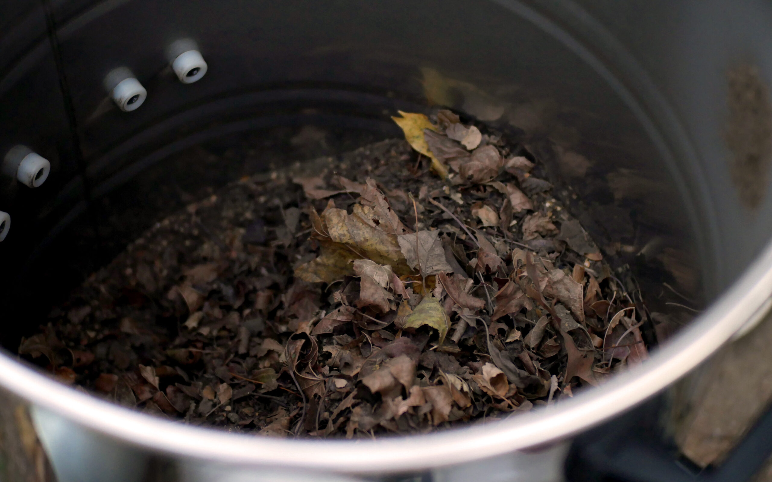 photo of leaf debris cleared from a gutter during cleaning